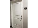 Entry to unit 1447 with white paneled door and brushed metal hardware at 870 Mayson Turner Nw Rd # 1447, Atlanta, GA 30314