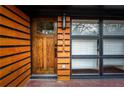 Inviting front door with unique vertical address display and natural wood accents near window at 1605 Ezra Church Nw Dr, Atlanta, GA 30314