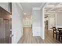 Inviting foyer with wood-look flooring, wainscoting detail, and views into the living spaces at 1867 Castleberry Ln, Buford, GA 30518