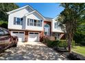 This inviting home boasts a beautiful brick and vinyl exterior, attached garage, and manicured landscaping at 3265 Bethesda Park Ct, Lawrenceville, GA 30044