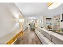 Bright living room featuring an open floorplan, wood floors, and modern decor at 2814 Vinings Central Se Dr # 151, Atlanta, GA 30339