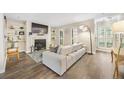 Comfortable living room with fireplace, built-ins, and hardwood flooring at 2814 Vinings Central Se Dr # 151, Atlanta, GA 30339