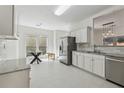 Spacious kitchen area with stainless steel appliances, breakfast nook and bright natural lighting at 5035 Pattingham Dr, Roswell, GA 30075