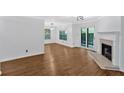 Spacious living room with a fireplace and sliding glass doors at 1438 N Crossing Ne Dr, Atlanta, GA 30329