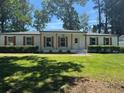 Attractive single-level home with a well-kept lawn, complemented by white brick and dark trim accents at 2678 Stardust Trl, Decatur, GA 30034
