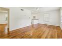 Bright living room features gleaming hardwood floors, fresh white paint, and natural light from large windows at 3314 Glenco Dr, Decatur, GA 30032