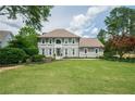 Beautifully landscaped front yard and two-story home featuring a large lawn and neutral color scheme at 435 Chantenay Pl, Alpharetta, GA 30022