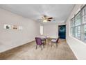 Cozy living room with carpet, ceiling fan and a dark front door at 14300 Veterans Memorial Highway, Villa Rica, GA 30180