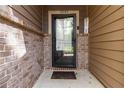 Inviting front entrance with a black-framed glass door, brick accents, and the house number prominently displayed at 1945 Bay Beauty Ln # 10, Austell, GA 30106