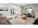 Bright living room with hardwood floors, neutral paint, and stylish furnishings, creating a welcoming atmosphere at 2410 Bridle Bridge Trl, Cumming, GA 30040