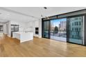 Bright, open kitchen with stainless steel appliances, island and access to outdoor patio at 2520 Peachtree Nw Rd # 403, Atlanta, GA 30305