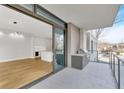 Open living area with chef's kitchen and access to outdoor patio featuring built in outdoor grill at 2520 Peachtree Nw Rd # 403, Atlanta, GA 30305