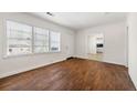 Open living space with gleaming hardwood floors and plenty of natural light at 3723 Glenwood Rd, Decatur, GA 30032