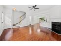 Bright, open-concept living room with hardwood floors and a cozy fireplace at 1135 Kilmington Ct, Alpharetta, GA 30009