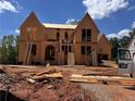 New construction home in progress shows framing and structural elements at 6740 Pannell Rd, Buford, GA 30518
