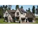 Stunning traditional new home exterior elevation featuring a three car garage at 6740 Pannell Rd, Buford, GA 30518