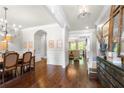 Elegant living room features beautiful hardwood floors and natural light at 12980 Overlook Pass, Roswell, GA 30075
