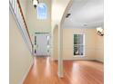 Inviting foyer featuring hardwood floors, staircase, and arched doorways, providing a bright and open entrance at 4942 Brown Leaf Dr, Powder Springs, GA 30127
