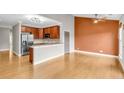 Bright open-concept living room with hardwood floors, stainless steel appliances, and a modern design at 1628 Briarcliff Ne Rd # 15, Atlanta, GA 30306