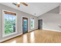 Sun-filled living room with large windows offering picturesque views and gleaming hardwood floors at 1628 Briarcliff Ne Rd # 15, Atlanta, GA 30306