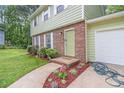 Close-up of front entrance, showcasing brickwork and landscaping at 2722 Springside Ct, Douglasville, GA 30135