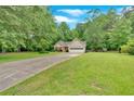 Charming single-Gathering home featuring a well-maintained lawn and attached two car garage at 3663 Homewood Trl, Powder Springs, GA 30127