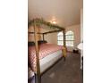 Bedroom with queen bed and arched windows at 185 Windhaven Sw Trl, Atlanta, GA 30331