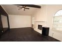 Vaulted living room with dark hardwood floors and a white painted brick fireplace at 185 Windhaven Sw Trl, Atlanta, GA 30331
