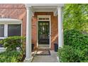 Inviting front entrance with classic columns, elegant door, and manicured landscaping at 2329 Marion Walk Se Dr # 5, Atlanta, GA 30339