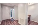 Bright entryway featuring wood floors, white walls, and neutral accents at 1515 Barrier Rd, Marietta, GA 30066