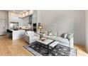 Open floorplan with a modern kitchen, living room, and hardwood floors at 40 12Th Ne St # 803, Atlanta, GA 30309