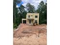 Beautiful two-story home with a garage and modern design set against a backdrop of lush greenery at 2918 Level Ridge Rd, Atlanta, GA 30354