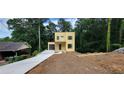 A modern two-story home with a spacious driveway and attached garage at 2918 Level Ridge Rd, Atlanta, GA 30354