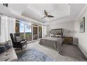 Spacious main bedroom with sitting area, balcony access, and neutral tones at 2881 Peachtree Ne Rd # 1102, Atlanta, GA 30305