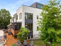 A private backyard features a wood deck, a seating area, a fenced-in area, and lots of green trees at 307 Cedar Dust Dr, Decatur, GA 30030