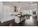 Modern kitchen featuring stainless steel appliances, a center island, and dark wood flooring at 307 Cedar Dust Dr, Decatur, GA 30030