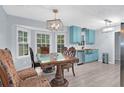 Eat-in kitchen with dining table and chairs adjacent to updated cabinets and stainless steel appliances at 3178 Booths Ct, Dacula, GA 30019