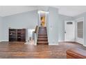 Spacious living room features a striking staircase and plenty of natural light at 3178 Booths Ct, Dacula, GA 30019
