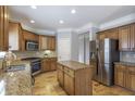 Spacious kitchen featuring granite countertops, stainless steel appliances, and a functional center island at 4765 Silver Leaf Dr, Cumming, GA 30040