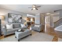 Comfortable living room with neutral tones, plush seating, and stylish decor, perfect for relaxation at 4765 Silver Leaf Dr, Cumming, GA 30040
