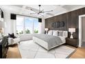 Beautiful main bedroom with coffered ceiling, wood accent wall, and large windows at 1248 Windmill Pkwy # 240, Cumming, GA 30041
