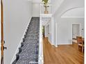 Bright foyer with staircase, hardwood floors, and neutral paint at 209 Wildwood Way, Canton, GA 30114
