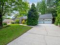 Charming single-Gathering home boasts a two-car garage and a well-manicured front lawn at 3177 Westfield Ne Way, Roswell, GA 30075