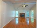 Open-concept living room showcases a fireplace, hardwood floors and great natural light at 3177 Westfield Ne Way, Roswell, GA 30075