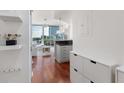 Hallway with hardwood floors leading to a modern living space with great city views at 3324 Peachtree Ne Rd # 1304, Atlanta, GA 30326