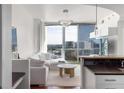 Bright, modern living room with floor to ceiling windows overlooking the city at 3324 Peachtree Ne Rd # 1304, Atlanta, GA 30326