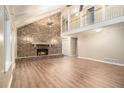 Bright and spacious living room with a brick fireplace and soaring vaulted ceilings at 4981 Forestglade Ct, Stone Mountain, GA 30087