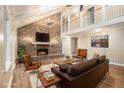 Inviting living room featuring a brick fireplace, vaulted ceilings, and hardwood floors at 4981 Forestglade Ct, Stone Mountain, GA 30087