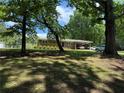 Traditional single story home with mature trees, and a covered carport at 232 Hembredge Dr, Canton, GA 30115
