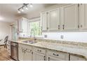 Kitchen with granite countertops, modern stainless steel appliances, and custom cabinets at 4314 Arbor Bridge Ct, Marietta, GA 30066